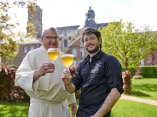 Abbey brewer Fr. Karel Stautemas and master brewer Marc-Antoine Sochon toast the opening of Grimbergen Abbey Brewery in Belgium.